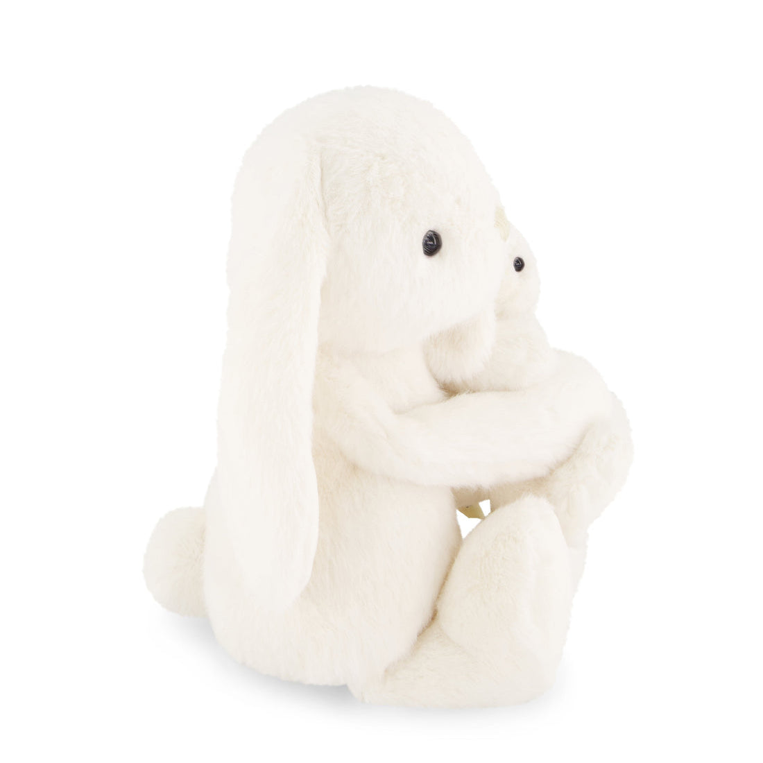 White plush toy sitting on a white background