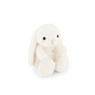 White stuffed bunny with black eyes.