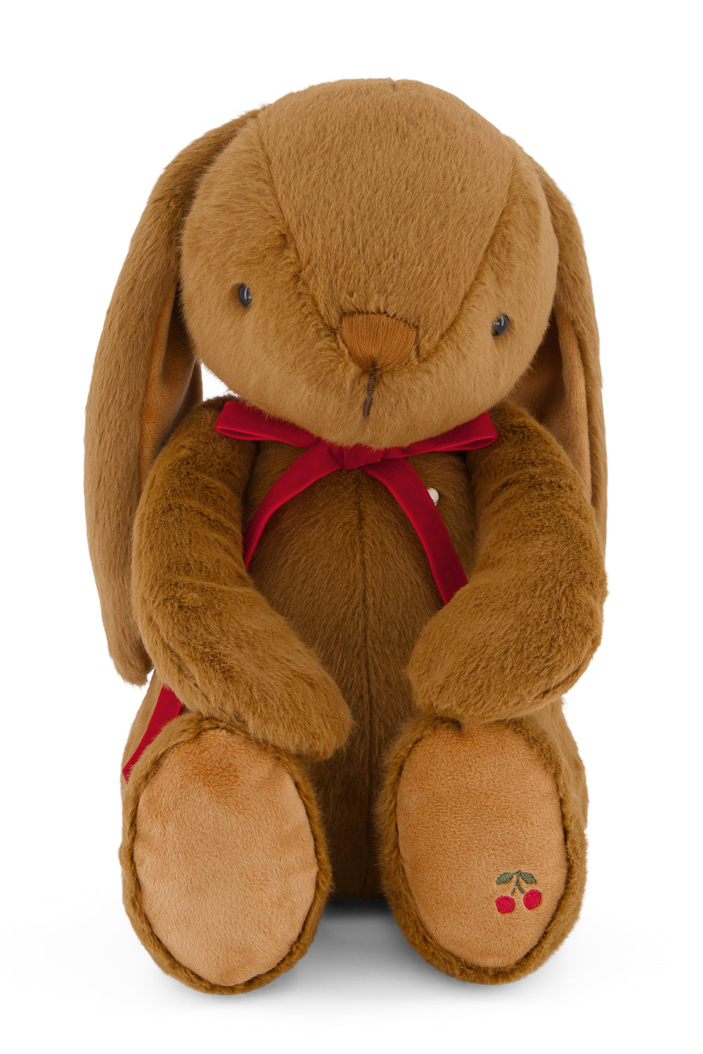 Brown plush bunny with a red bow tie on a white background