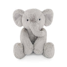 Gray plush elephant toy sitting.