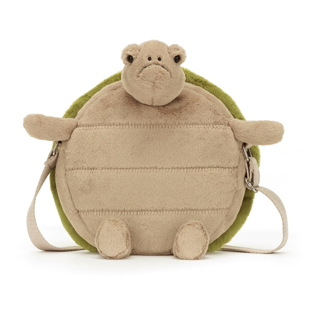 Tan plush turtle purse with green shell and shoulder straps.