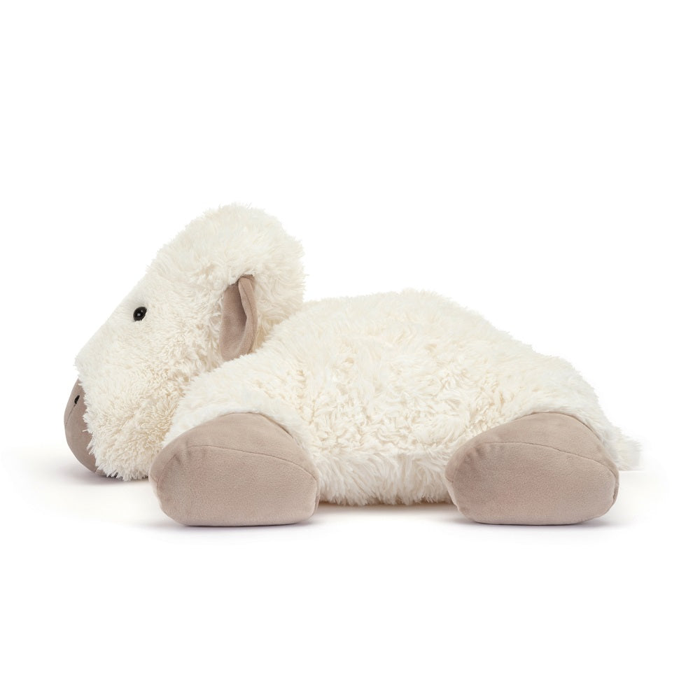 Lying down, white, plush, sheep toy.