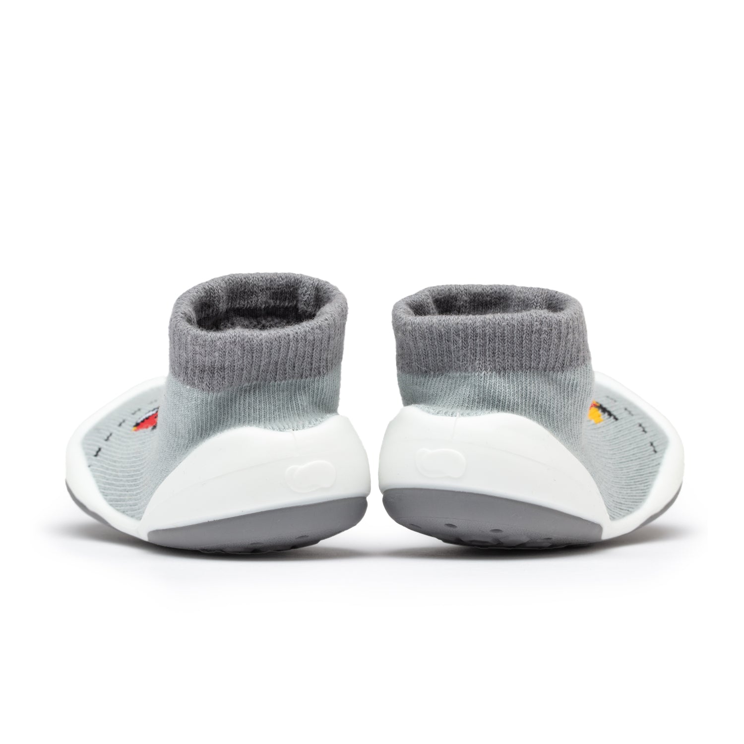 Two gray sock shoes with white soles.