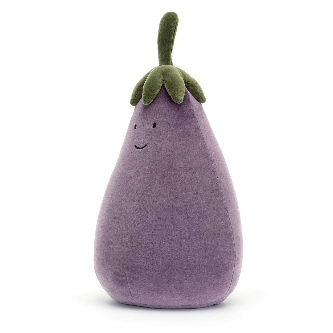 Stuffed eggplant toy with a smiling face.
