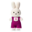 Crocheted Miffy doll wearing pink overalls.