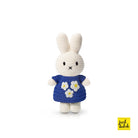 Crocheted rabbit doll wearing a blue dress with flower accents.