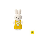 Crocheted Miffy doll in yellow flower overalls.