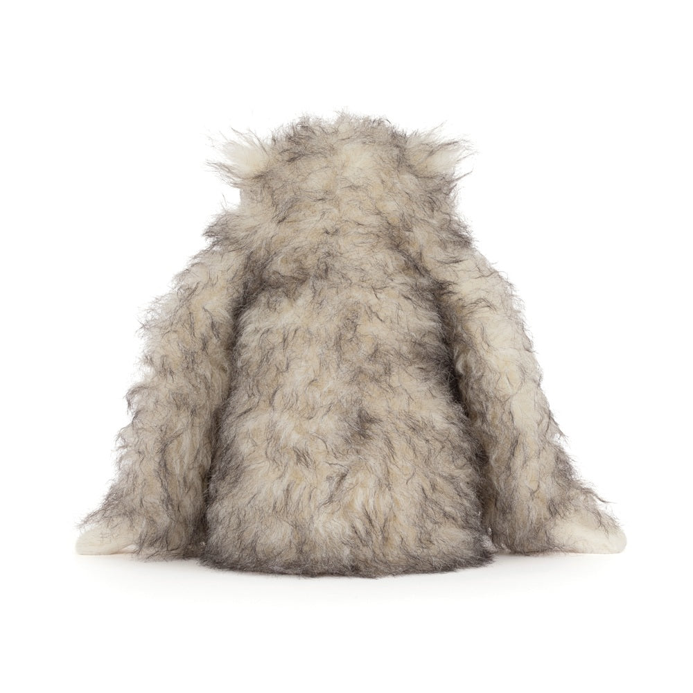 Fluffy gray toy on a white background