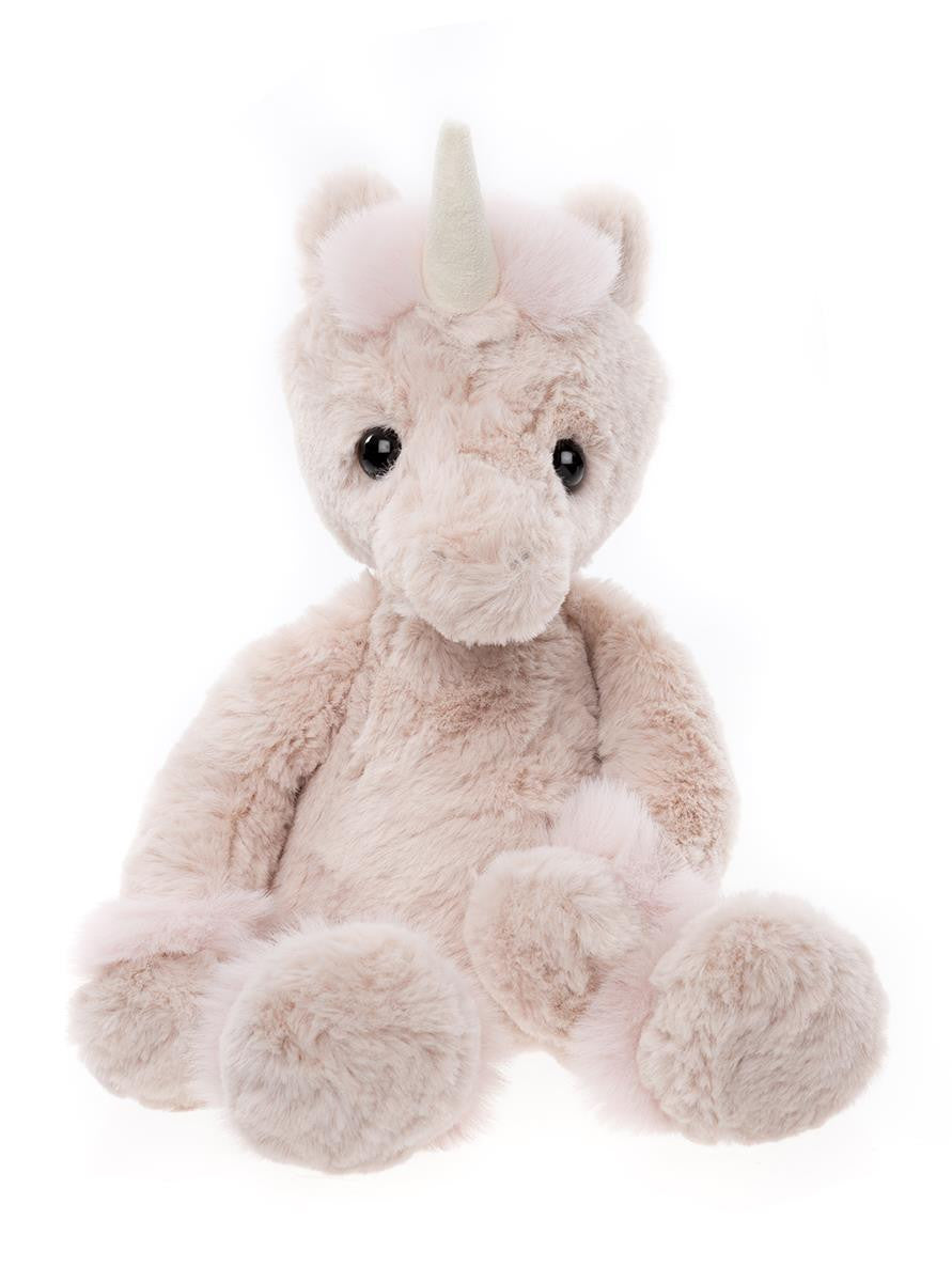 Plush unicorn toy on a white background