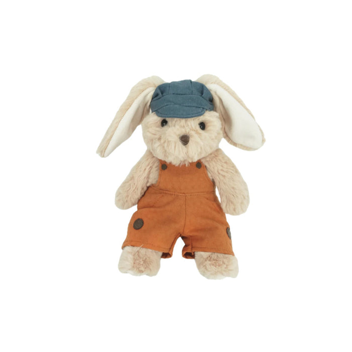 Stuffed bunny wearing blue cap and orange overalls.