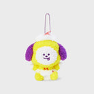 Plush yellow and white dog toy with purple ears, wearing a white and red hat and diaper, with a silver chain.