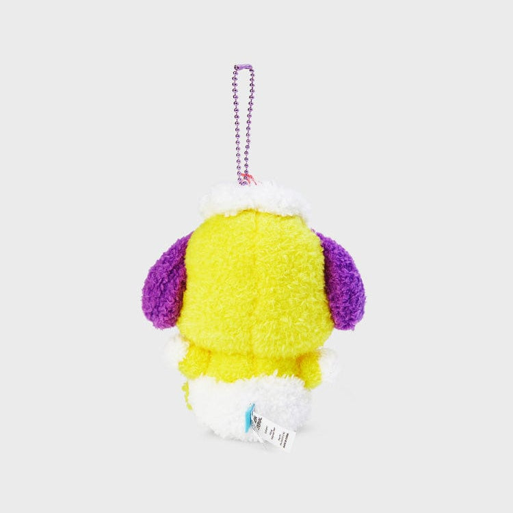 Yellow and purple plush toy hanging from a silver chain.