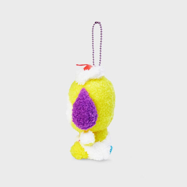 Yellow plush character with purple, white, and red details, attached to silver ball chain.