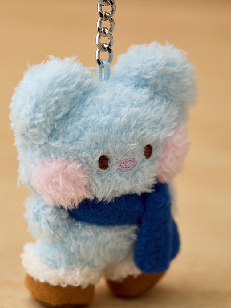 Plush blue toy with pink cheeks, scarf, and keychain.
