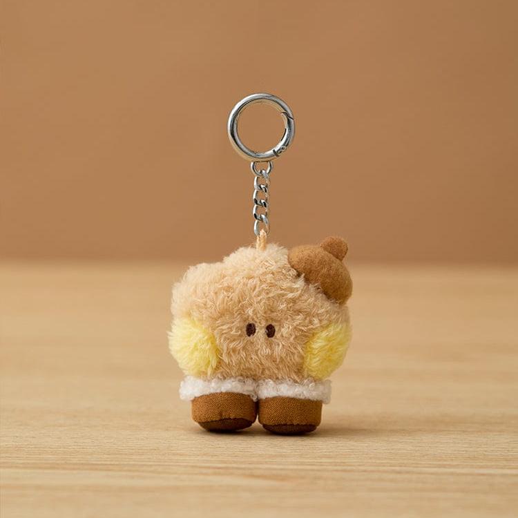 Teddy bear keychain with a brown hat.