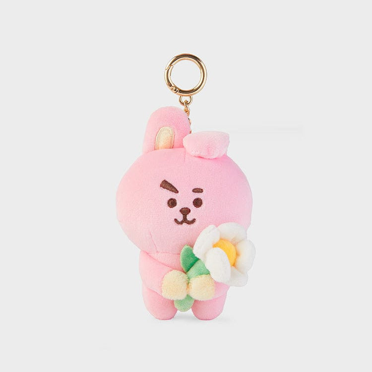 Pink plush bunny keychain with a flower.