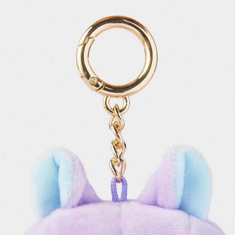 Gold-toned keychain attached to a purple and light blue stuffed animal.