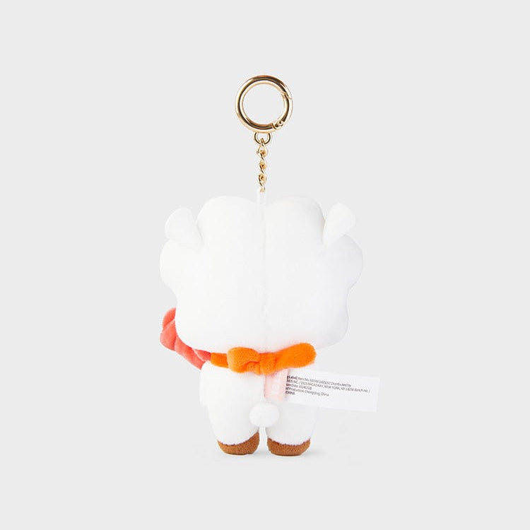 White sheep plush keychain with an orange bow and a gold ring.