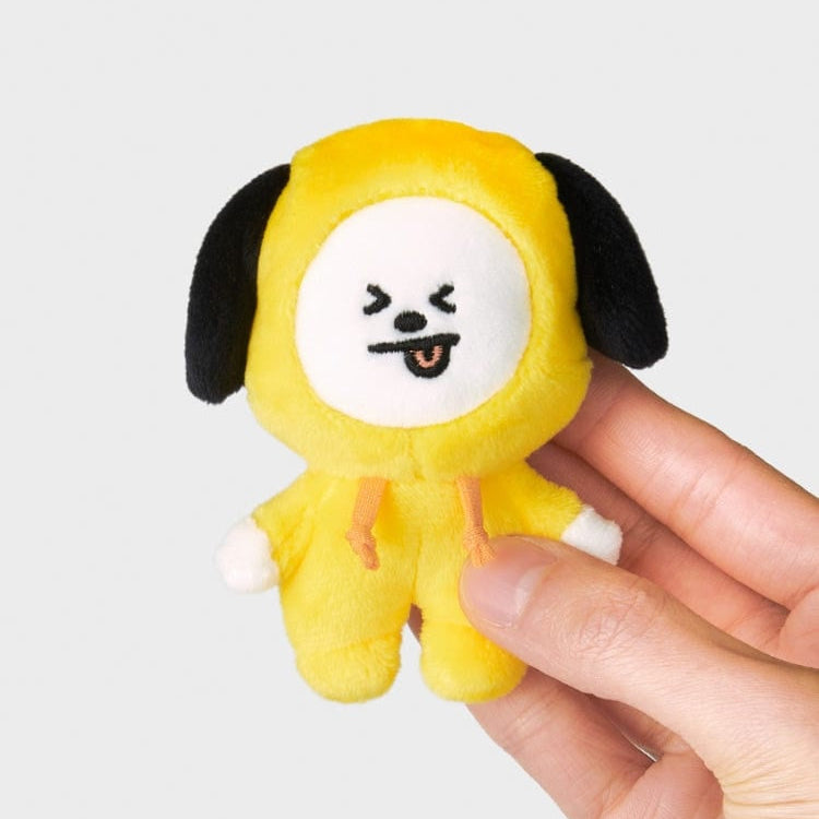 Yellow Chimmy plush doll held in a hand.