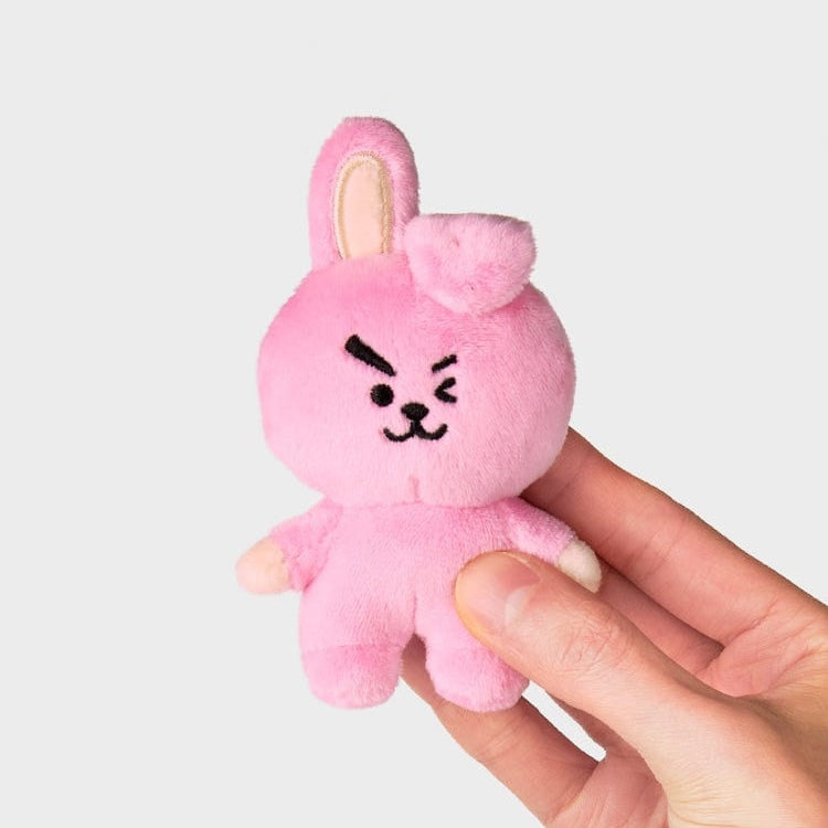 Pink Cooky plush doll in hand.