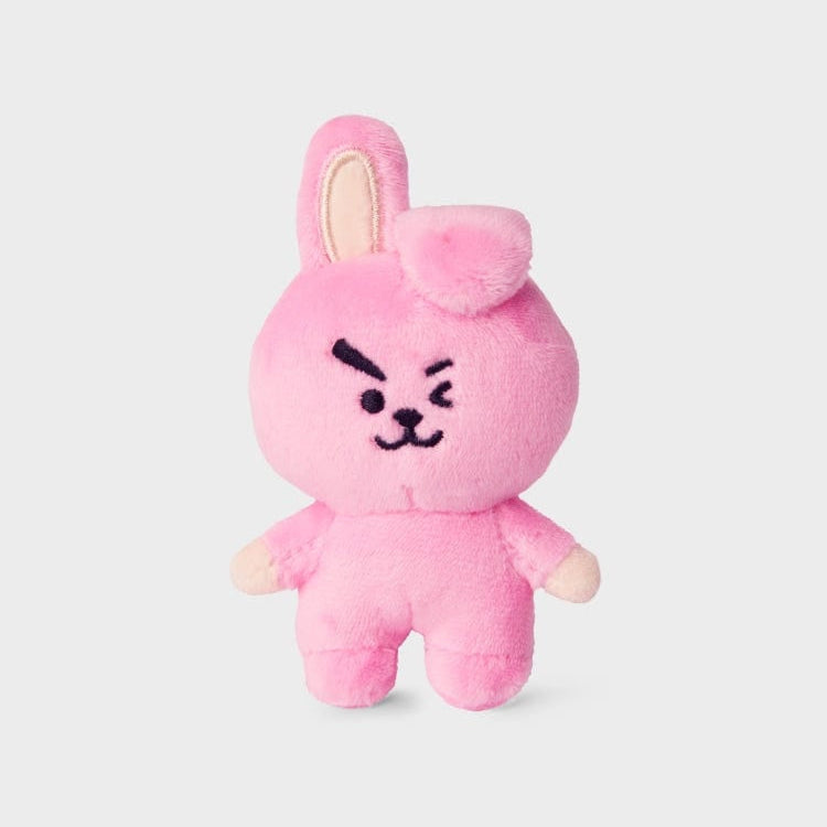 Pink stuffed rabbit toy with embroidered face.