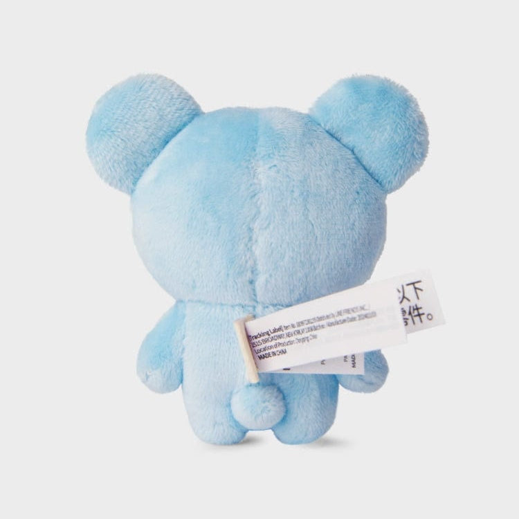 Rear view of a light blue plush teddy bear toy with tags.