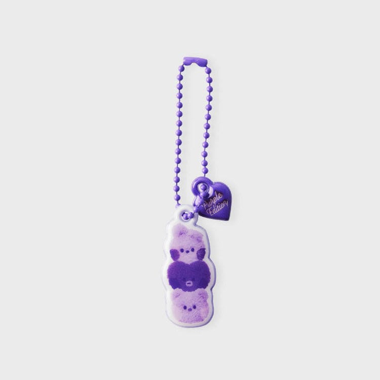 Purple keychain with a heart-shaped charm and a stack of cartoon bears.