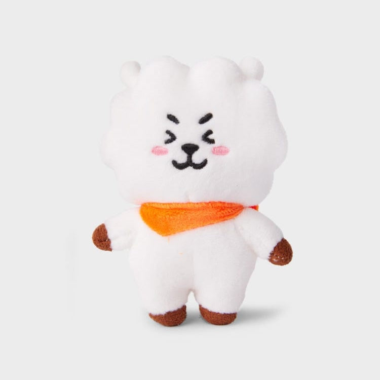White plush toy with orange scarf.