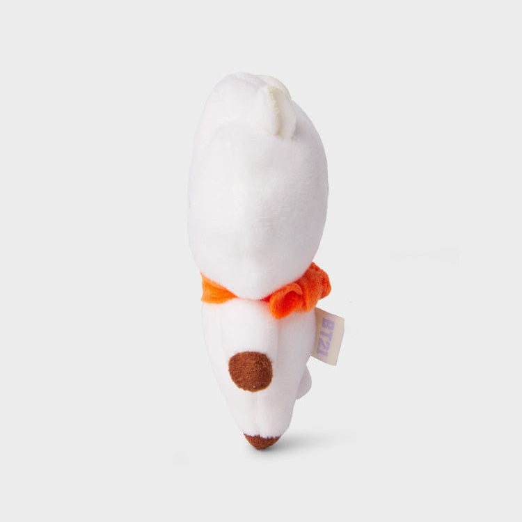 White plush toy with orange neck ruff and brown spots.