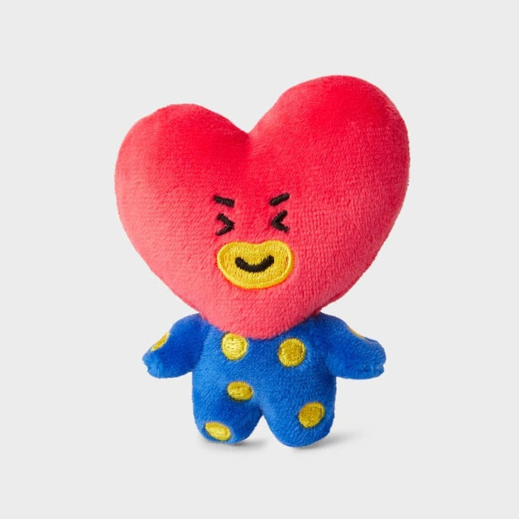 Red heart-shaped plush toy with blue polka dot body.