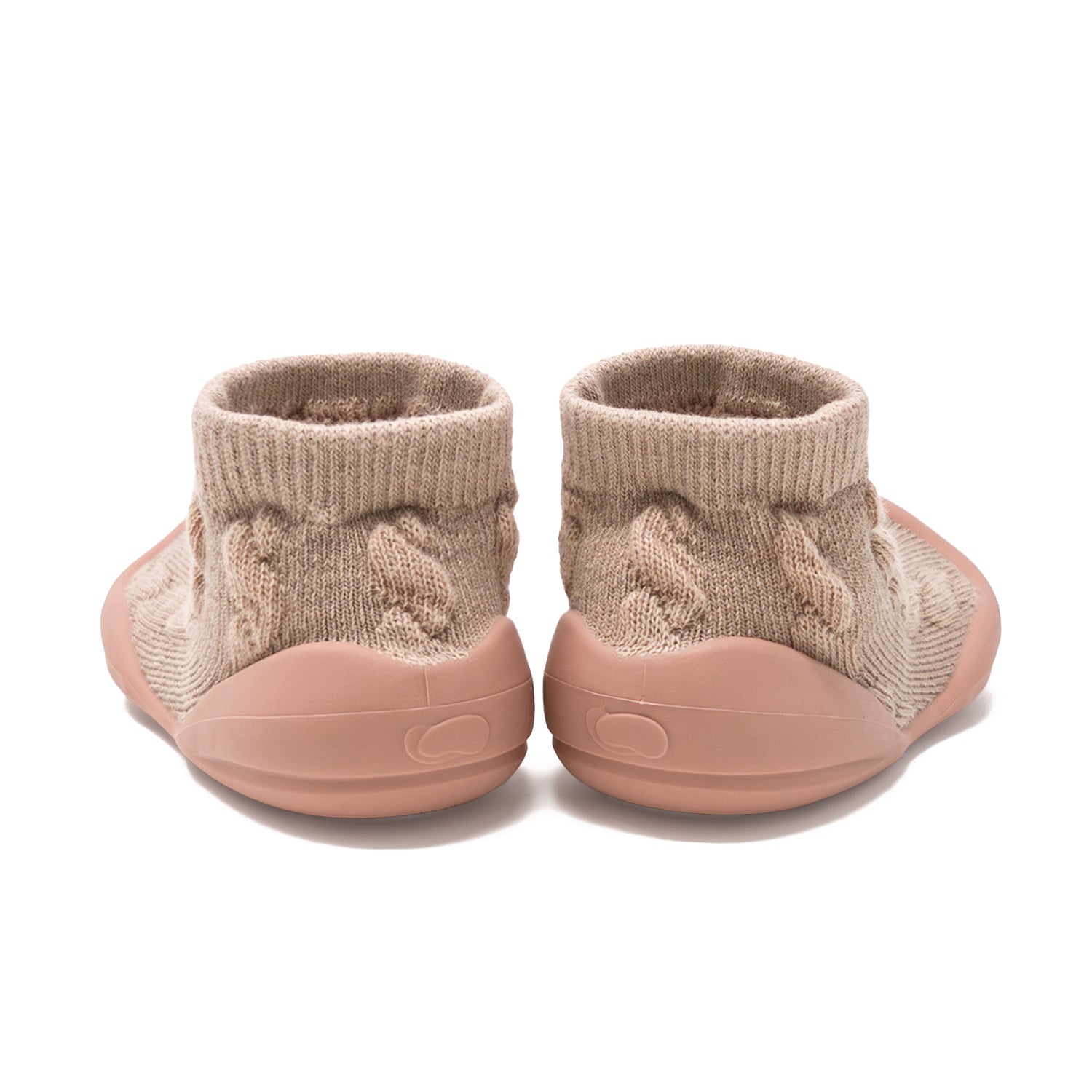 Two tan knit baby booties with rubber soles.