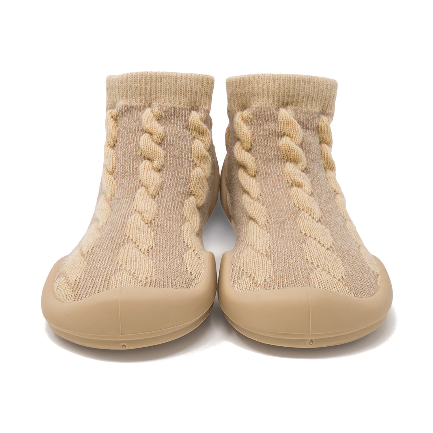 Two beige knit slipper socks with braided pattern and rubber soles.
