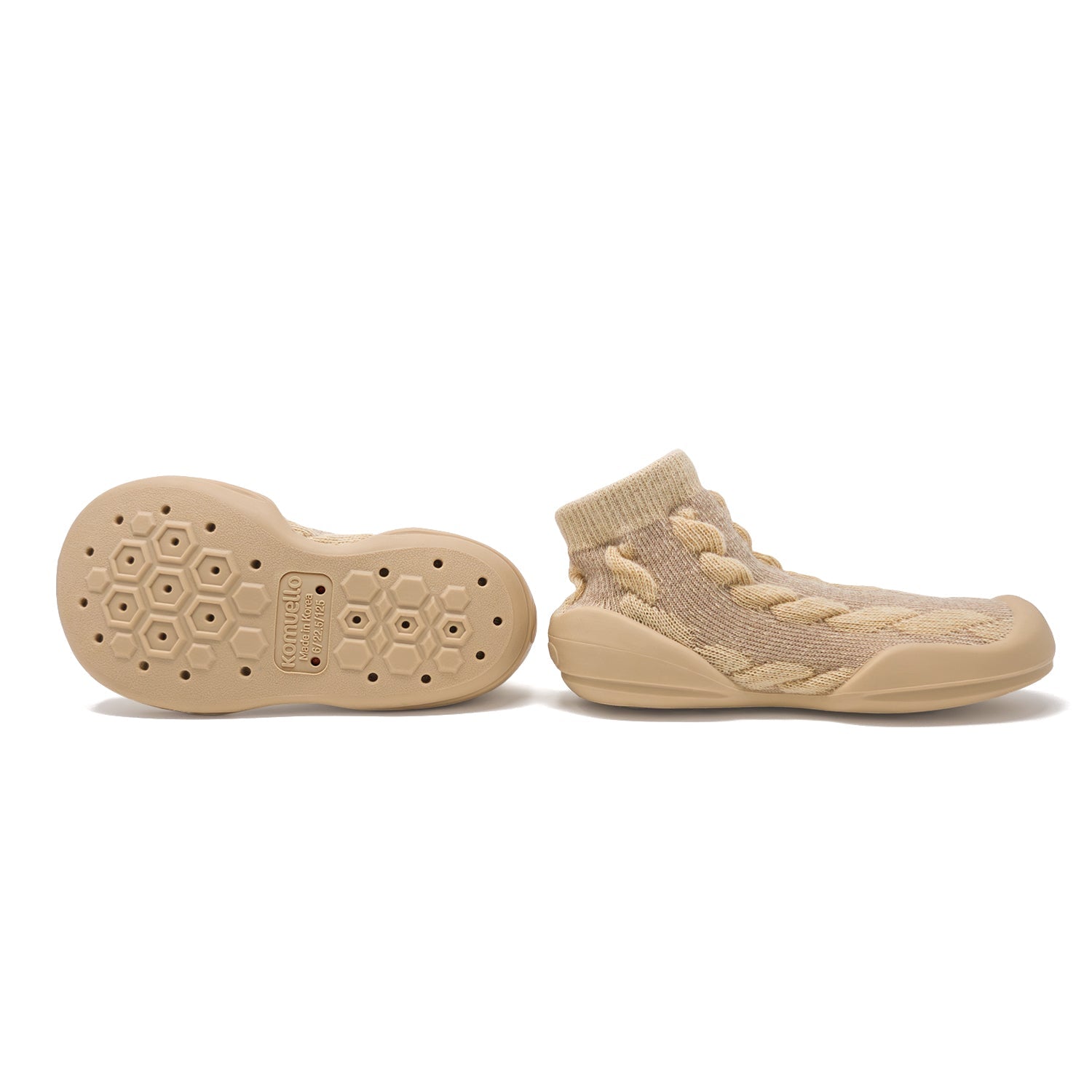 Tan knitted slipper socks with rubber soles.