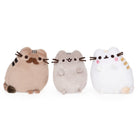 Three Pusheen plush toys, brown, gray, and white, on a white background.