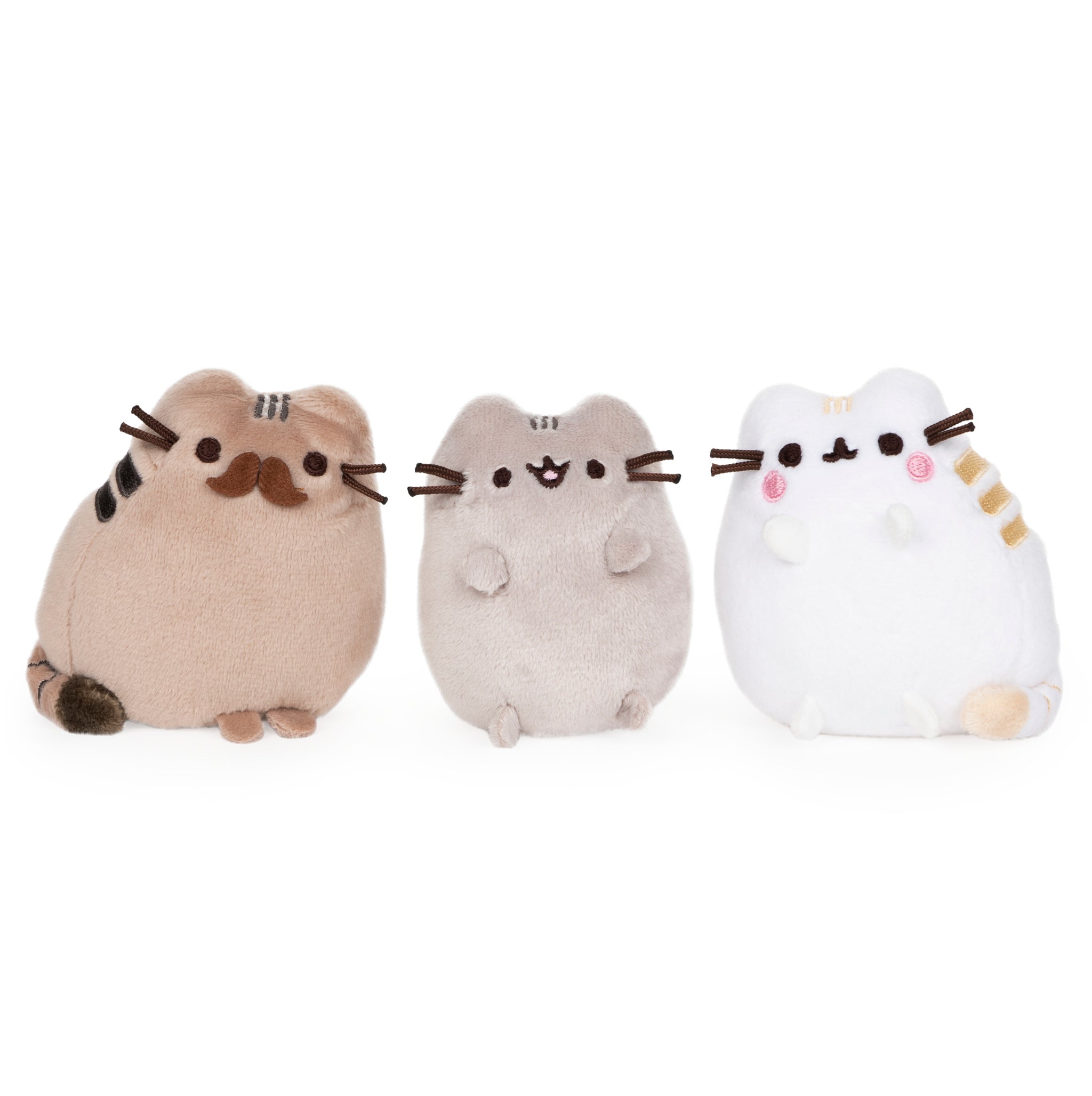 Three Pusheen plush toys, brown, gray, and white, on a white background.