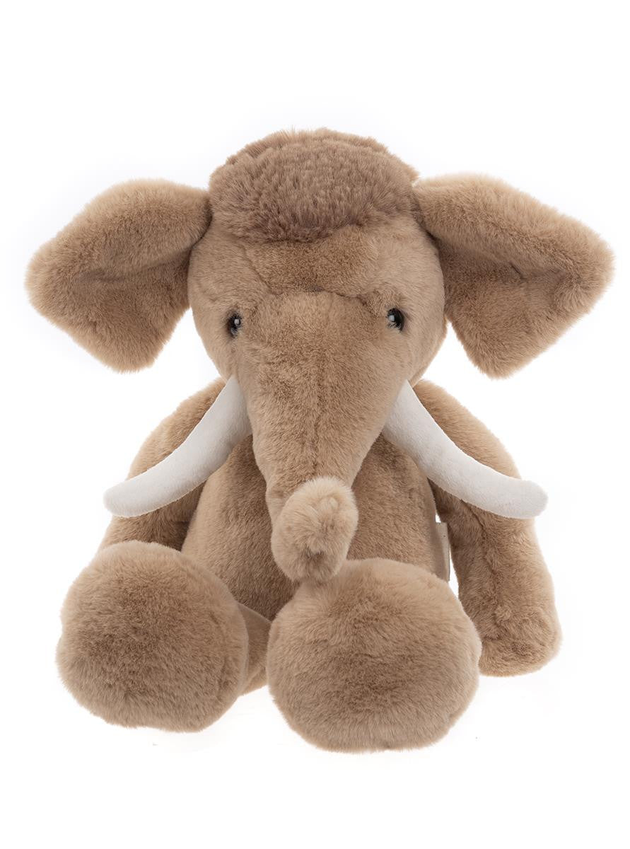 Plush elephant toy with white tusks on a white background