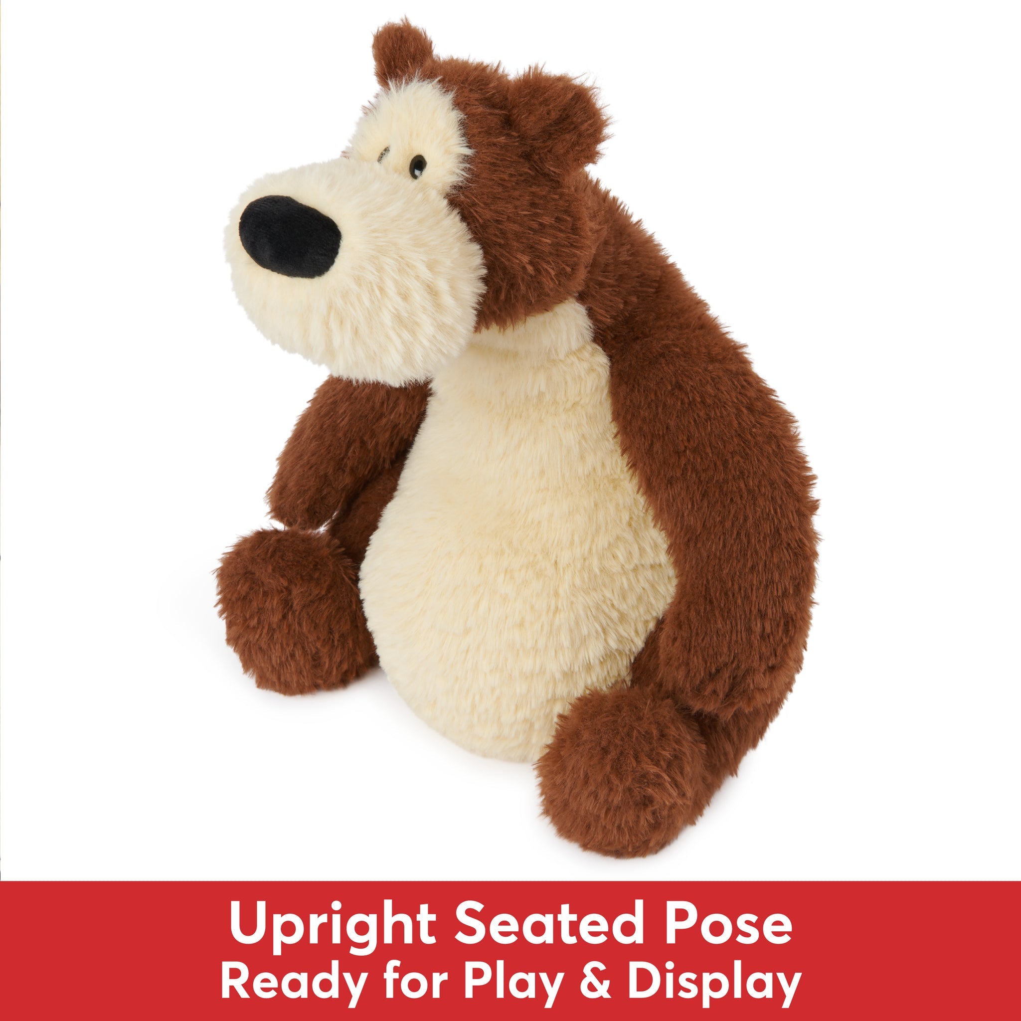 A brown and cream teddy bear sitting upright.