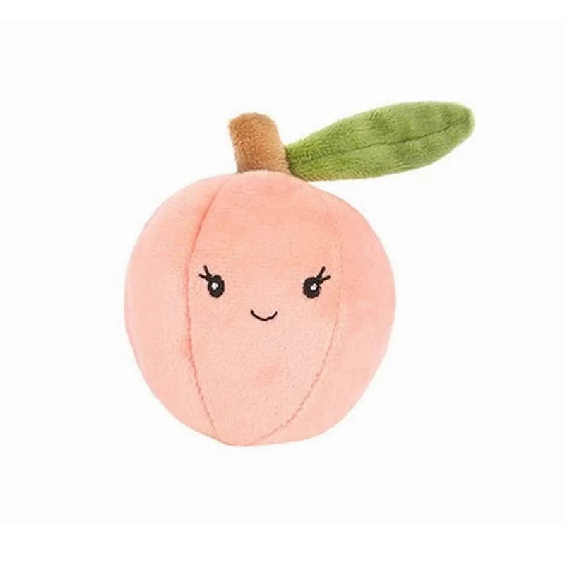 Plush toy shaped like a peach with a smiling face on a white background