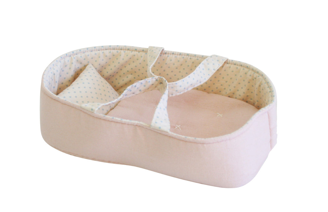 Pink and polka-dot doll bassinet.