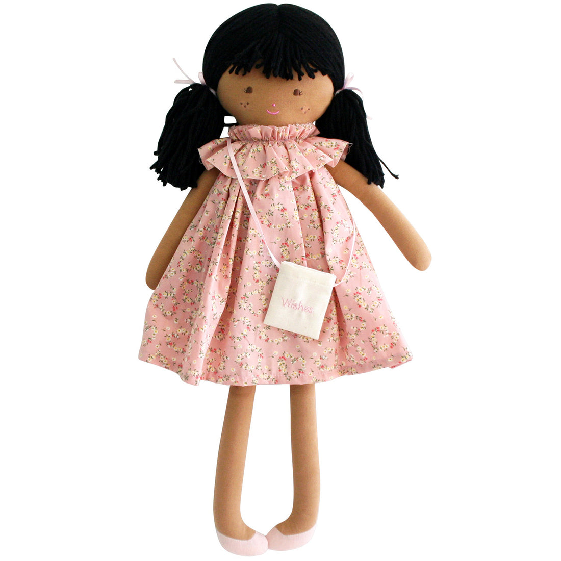 Cloth doll with black hair, pink floral dress, and "Wishes" bag.