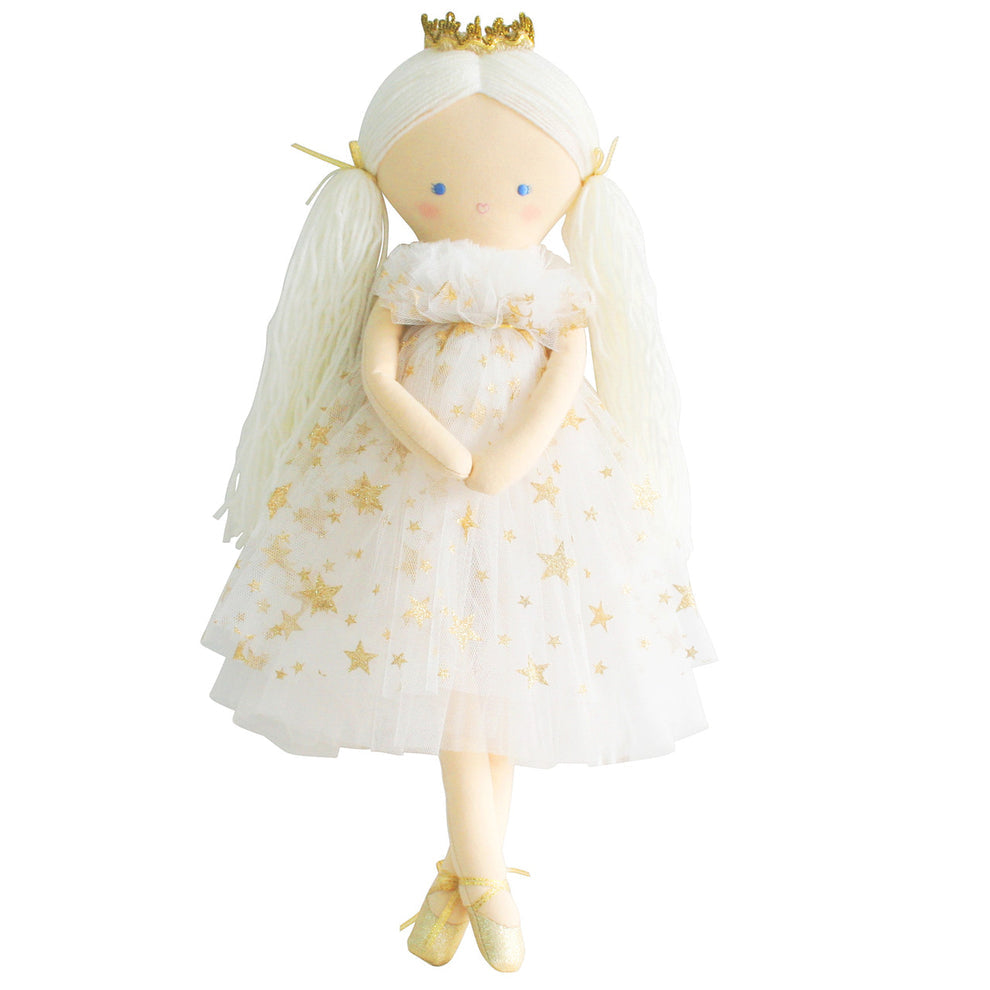 Cloth doll wearing a white and gold star dress and ballet shoes.