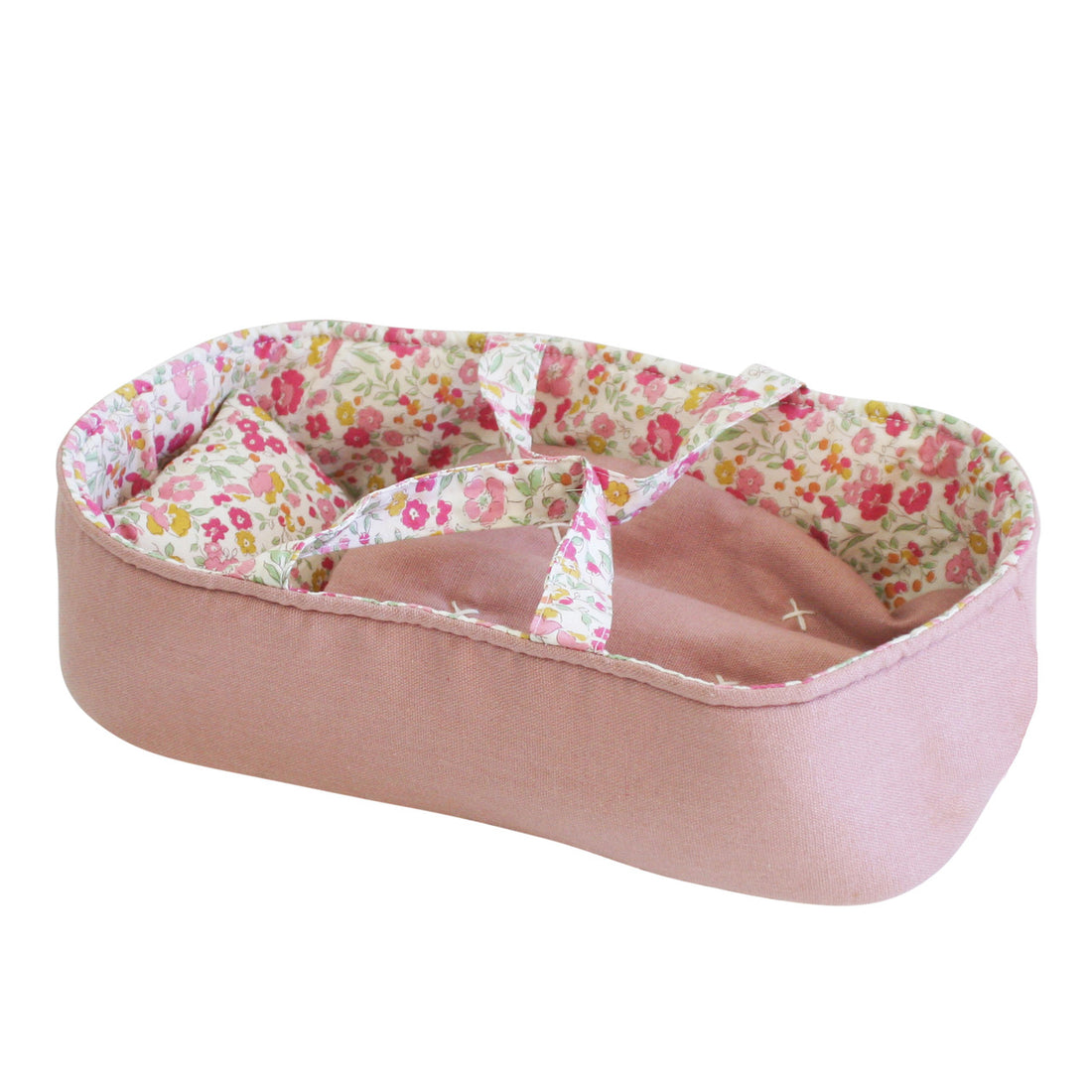 Pink fabric baby carrier with floral lining.