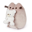 Stuffed cat plush toy holding a white teddy bear.