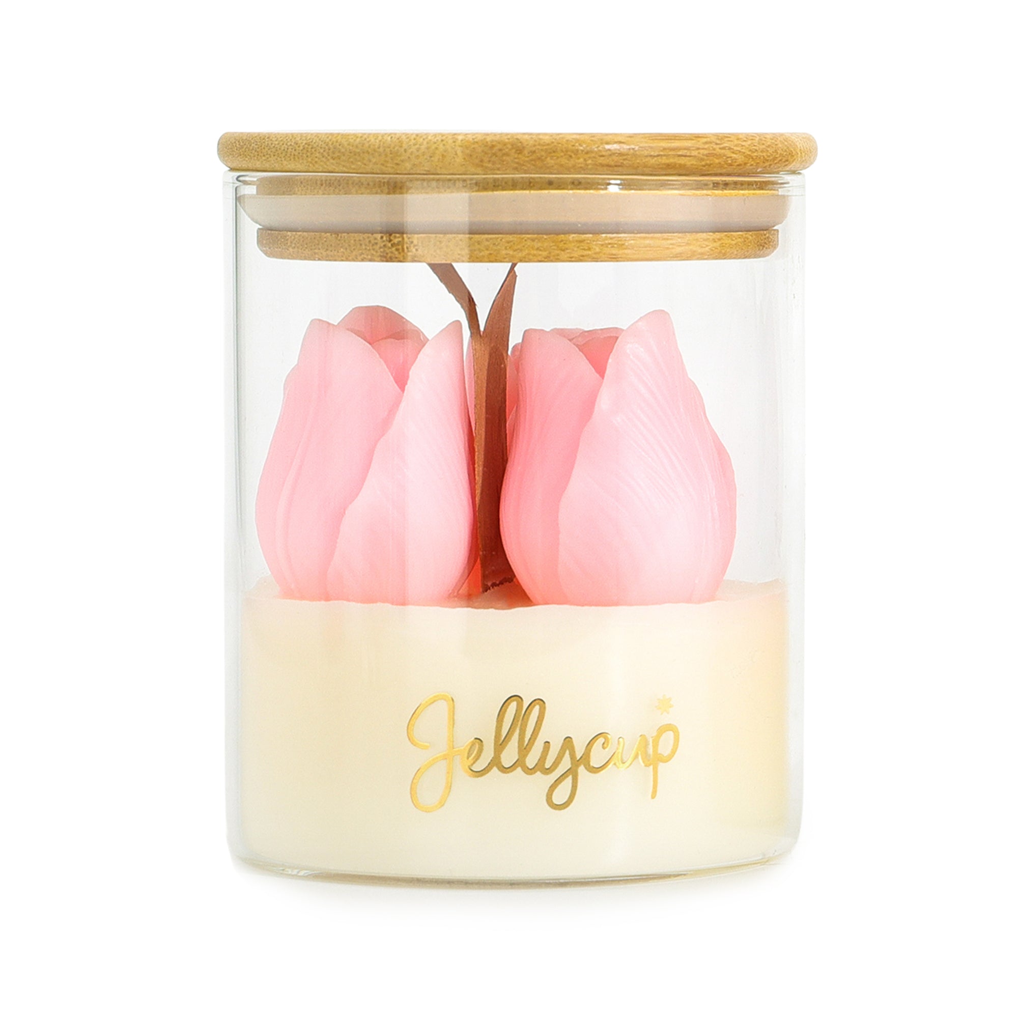 A clear glass jar candle with a bamboo lid, featuring two pink tulip-shaped wax flowers on a cream-colored wax base with gold 'Jellycup' branding.