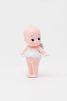 Figure toy resembling a baby on a white background