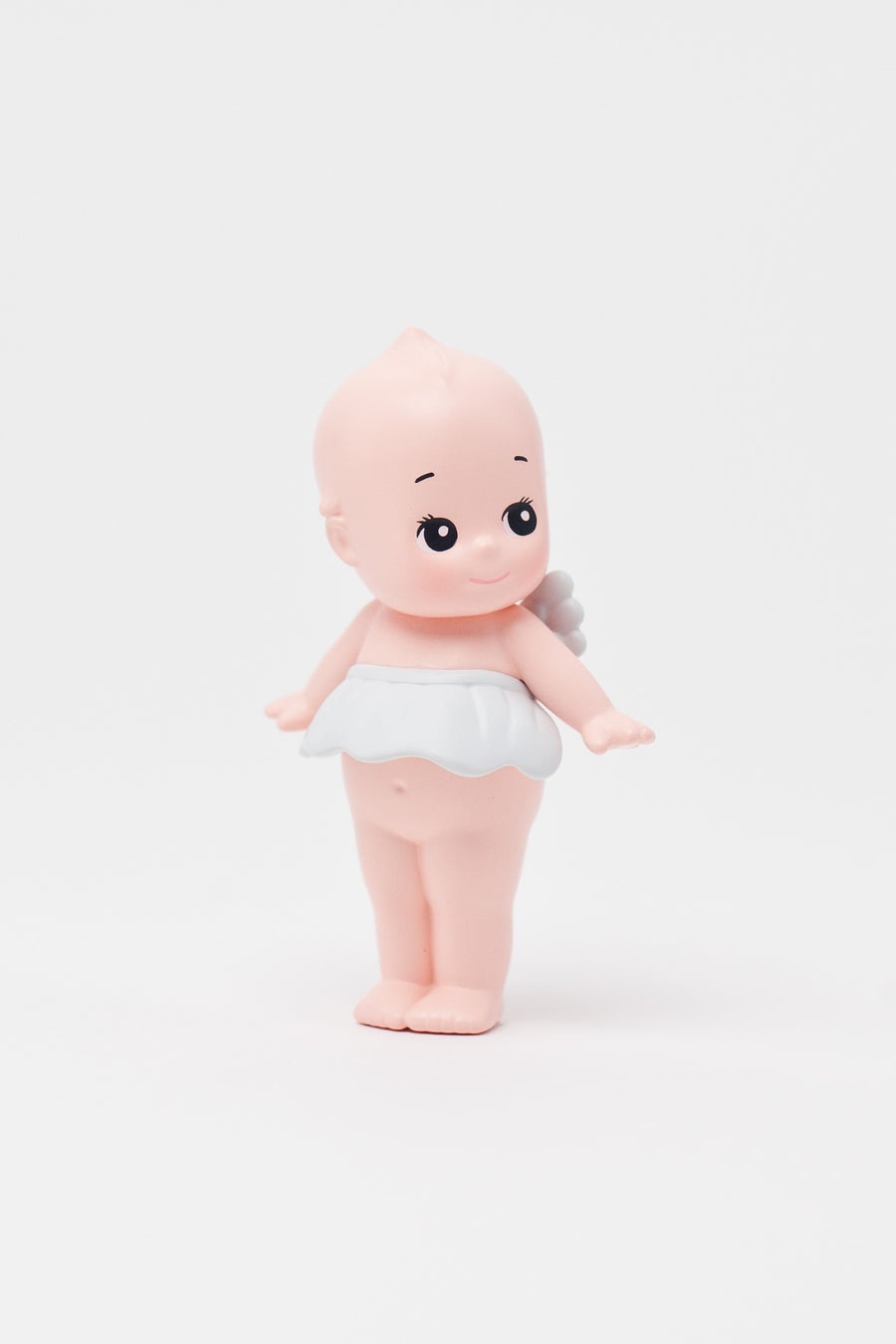 Figure toy resembling a baby on a white background