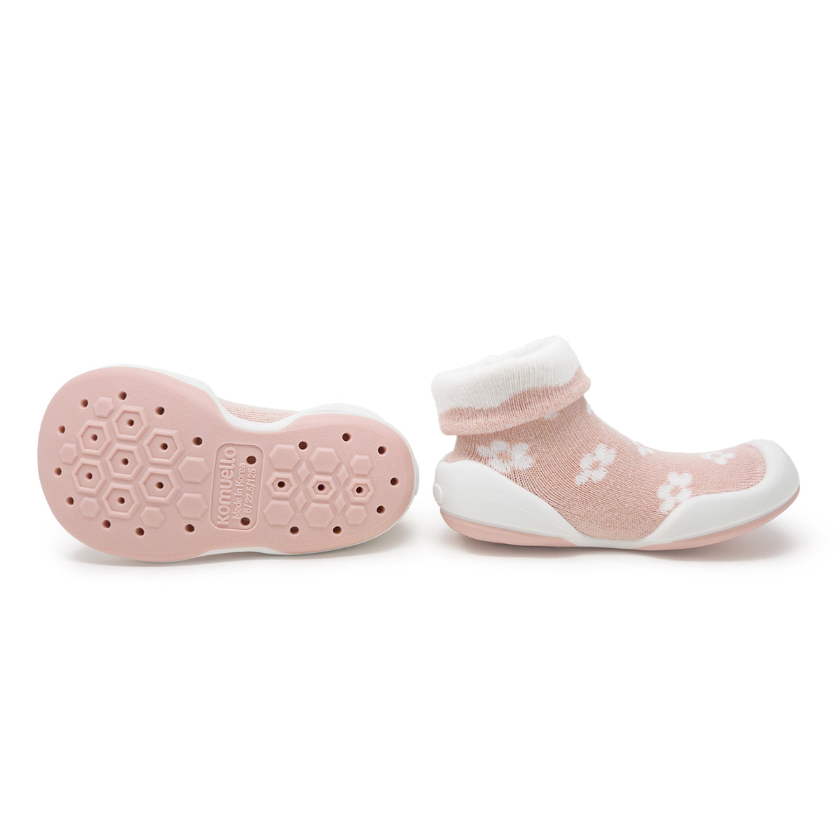 Pair of pink sock shoes with white floral pattern.