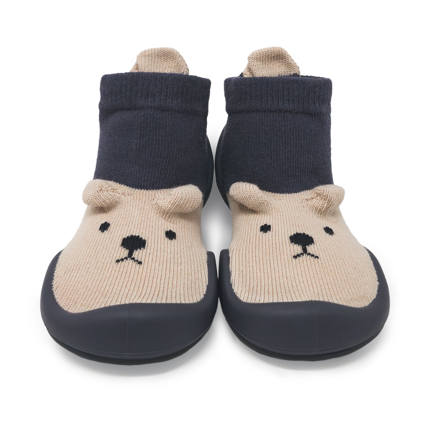 Pair of bear-themed socks with navy blue tops and beige feet on a white background