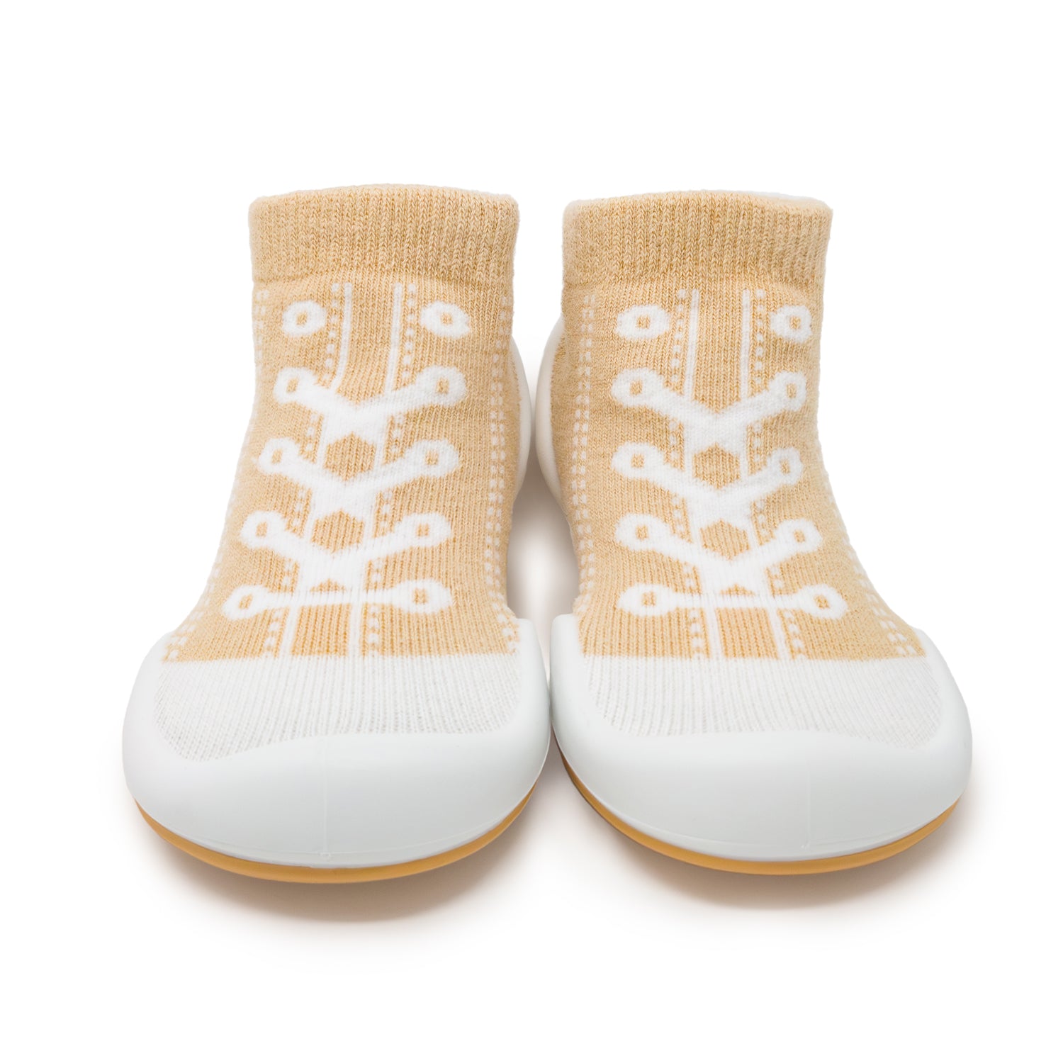 Pair of baby sock shoes in tan and white.