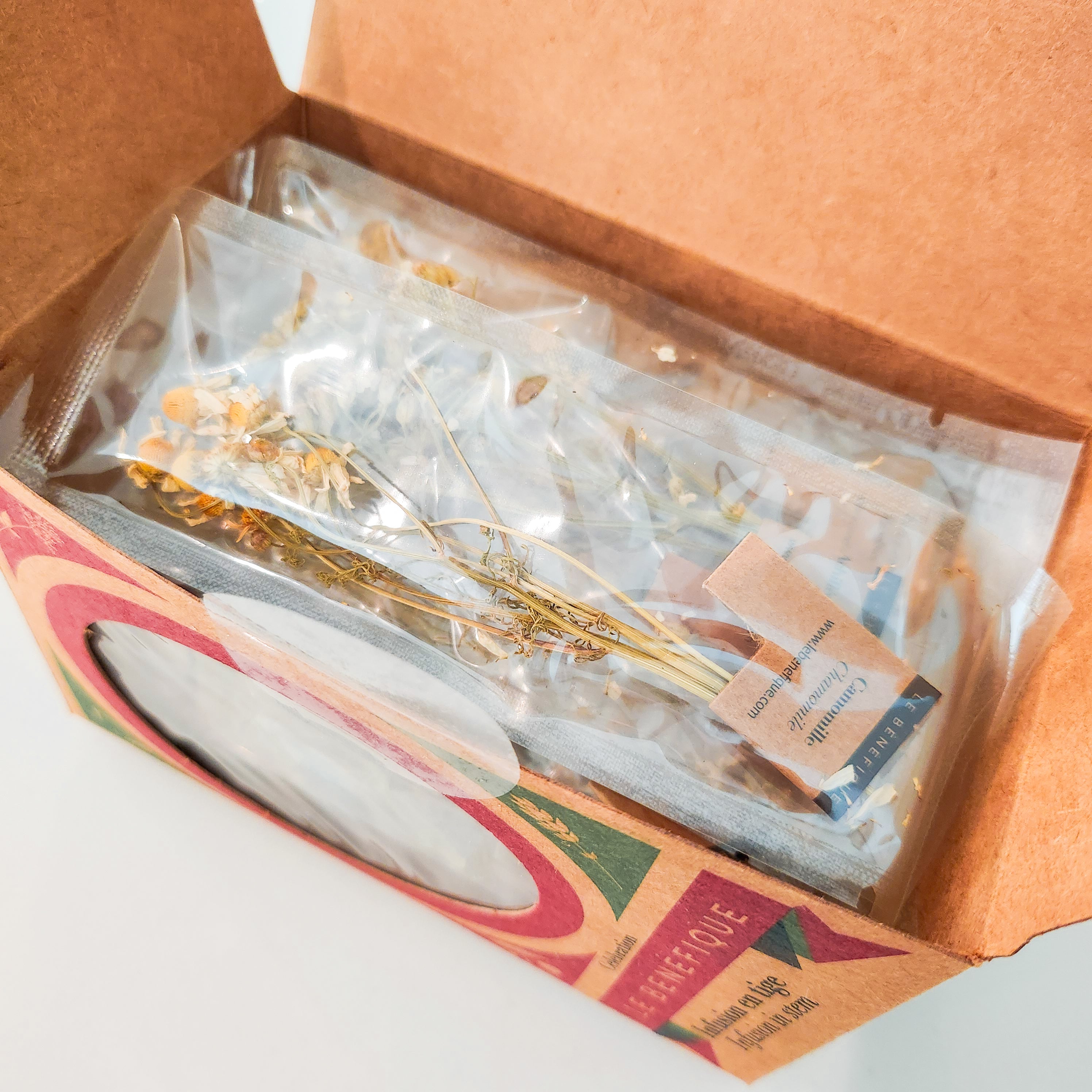 An opened box of chamomile tea bags.